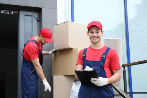 Local packing team preparing household boxes for a move in Coulsdon